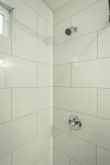 Bathroom with standing tile shower